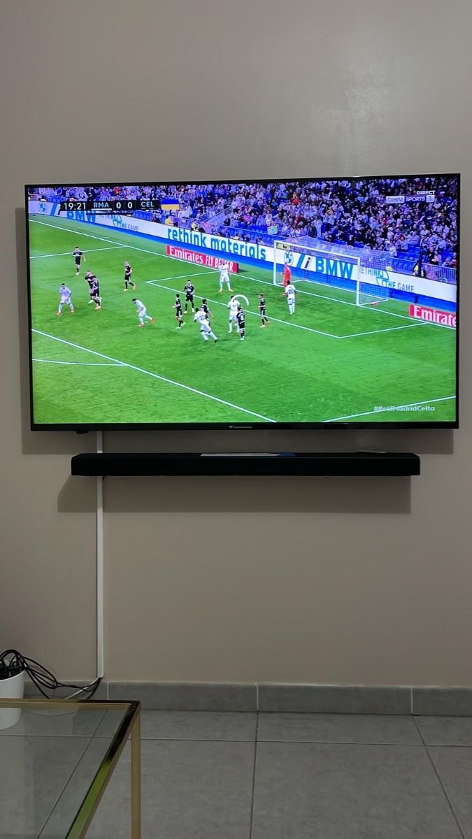 Wide flat screen television showing IPTVON entertainment home menu